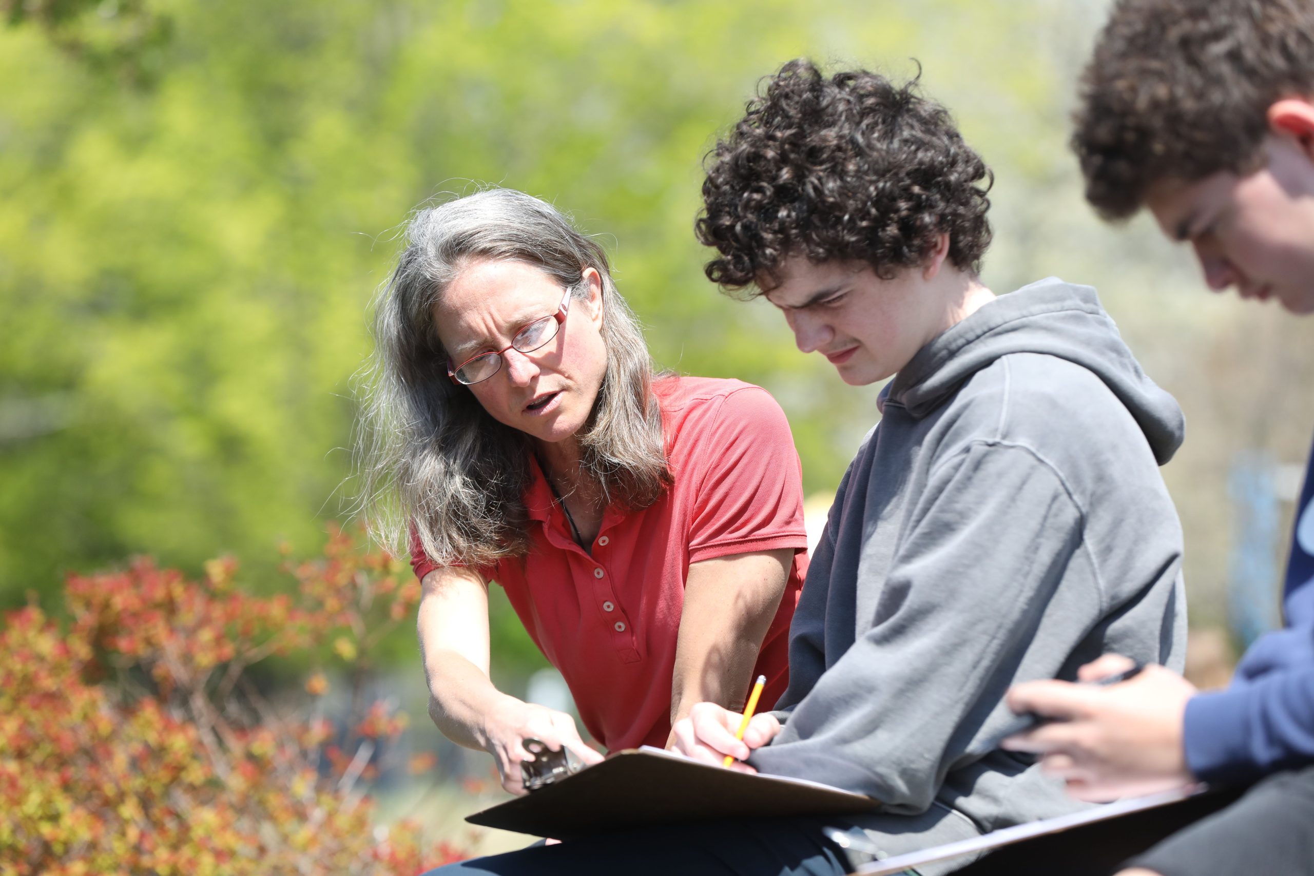 Teacher and bancroft School Upper School student working outside.